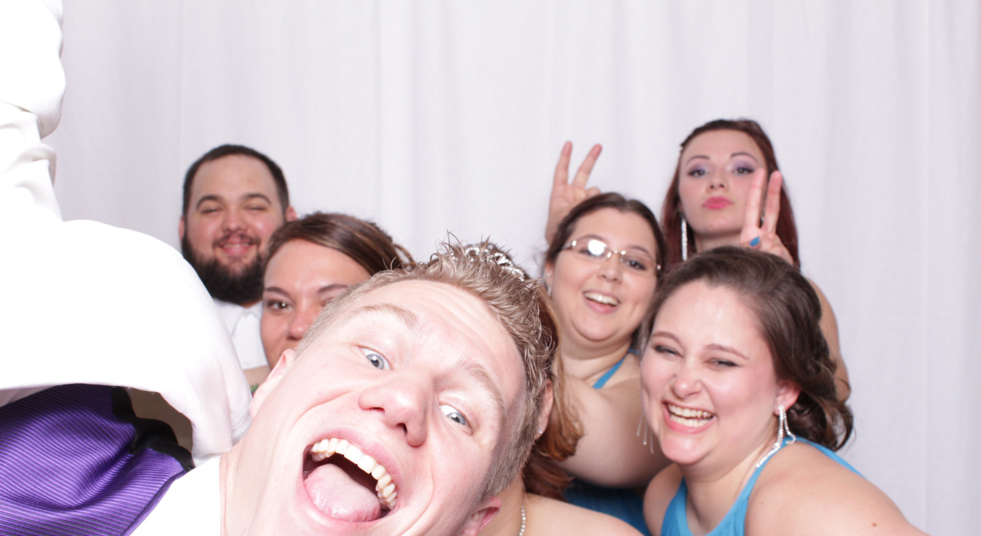 Seven guests posing in photo booth