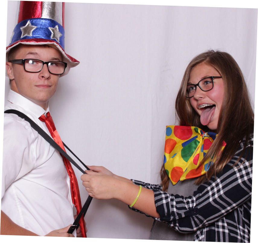 Two guests posing in photo booth