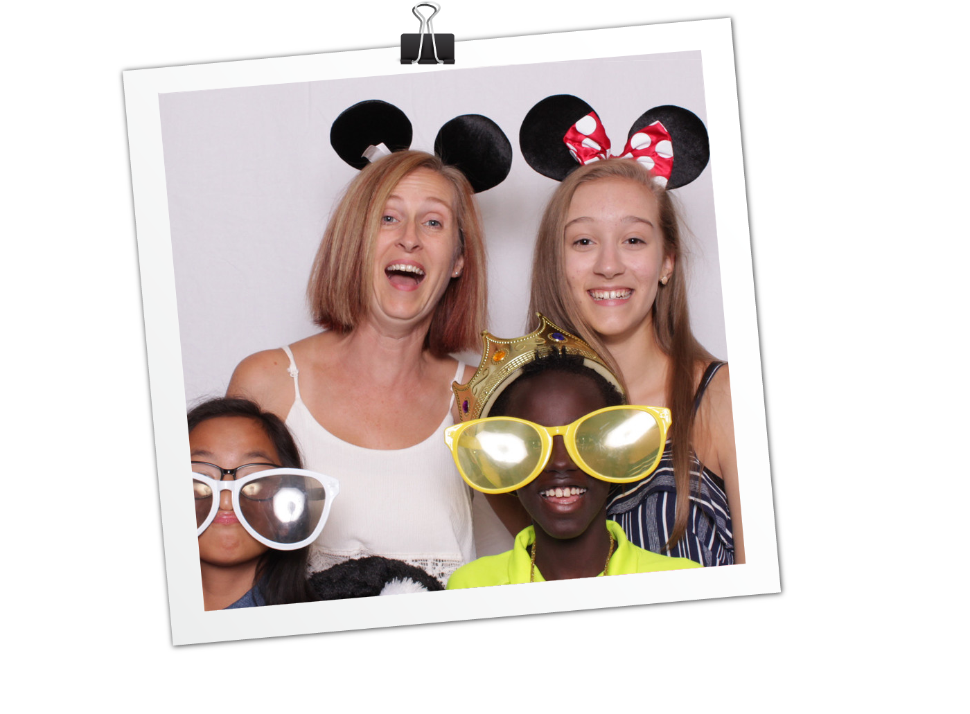 Four girls posing in photo booth